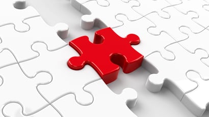 Puzzle blanc avec une pièce rouge